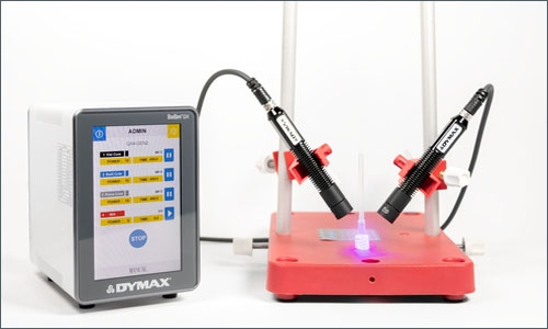 A Dymax Bluewave QX4 LED spot lamp light cures an adhesive&nbsp;on plastic components to quickly bond them together.